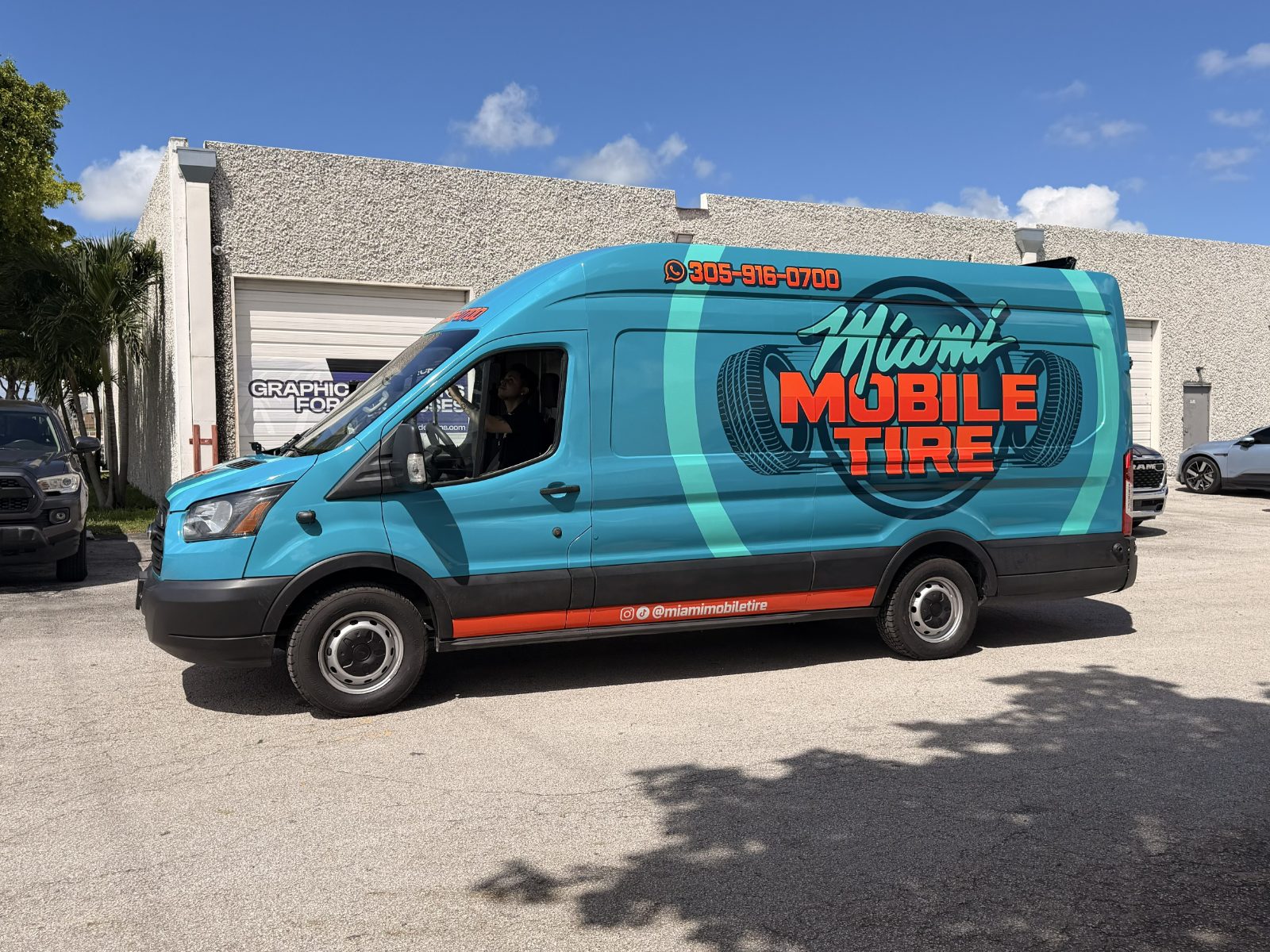 Miami Mobile Tire van with a turquoise and orange wrap